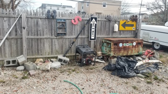 trash and debris in the yard