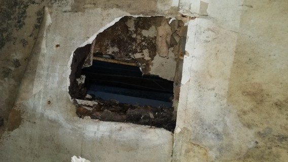hole in wall into other house